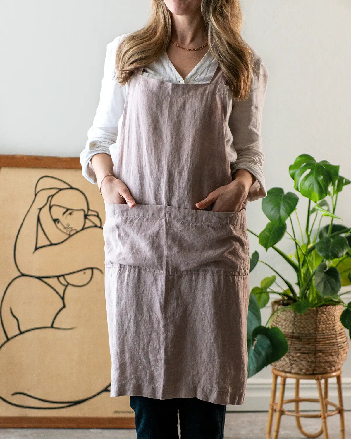 Ett korsförkläde i ljus rosa